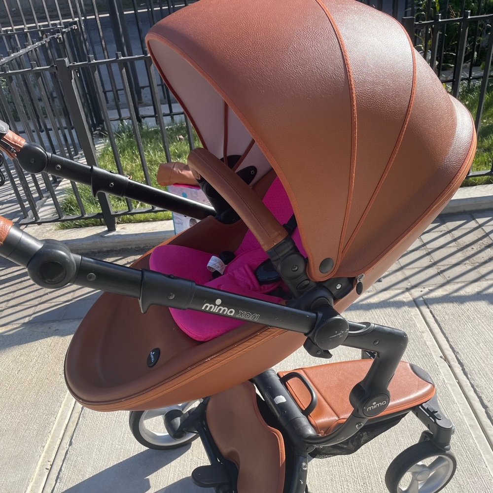 Camel Mima with pink carry cot stroller